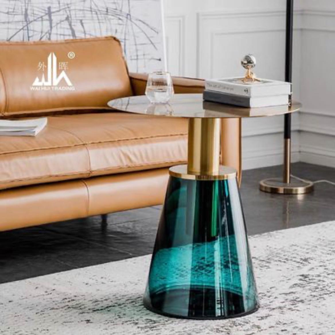 Several creative stained glass transparent coffee tables with luxurious round corners by the sofa