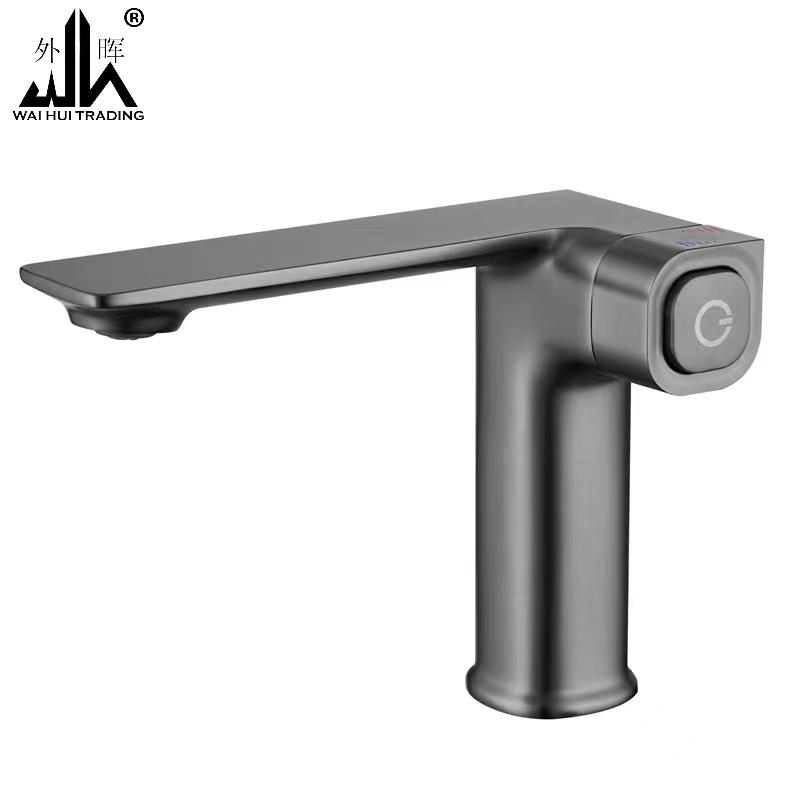 Toilet, bathroom, washbasin, sink, black and gray faucet.